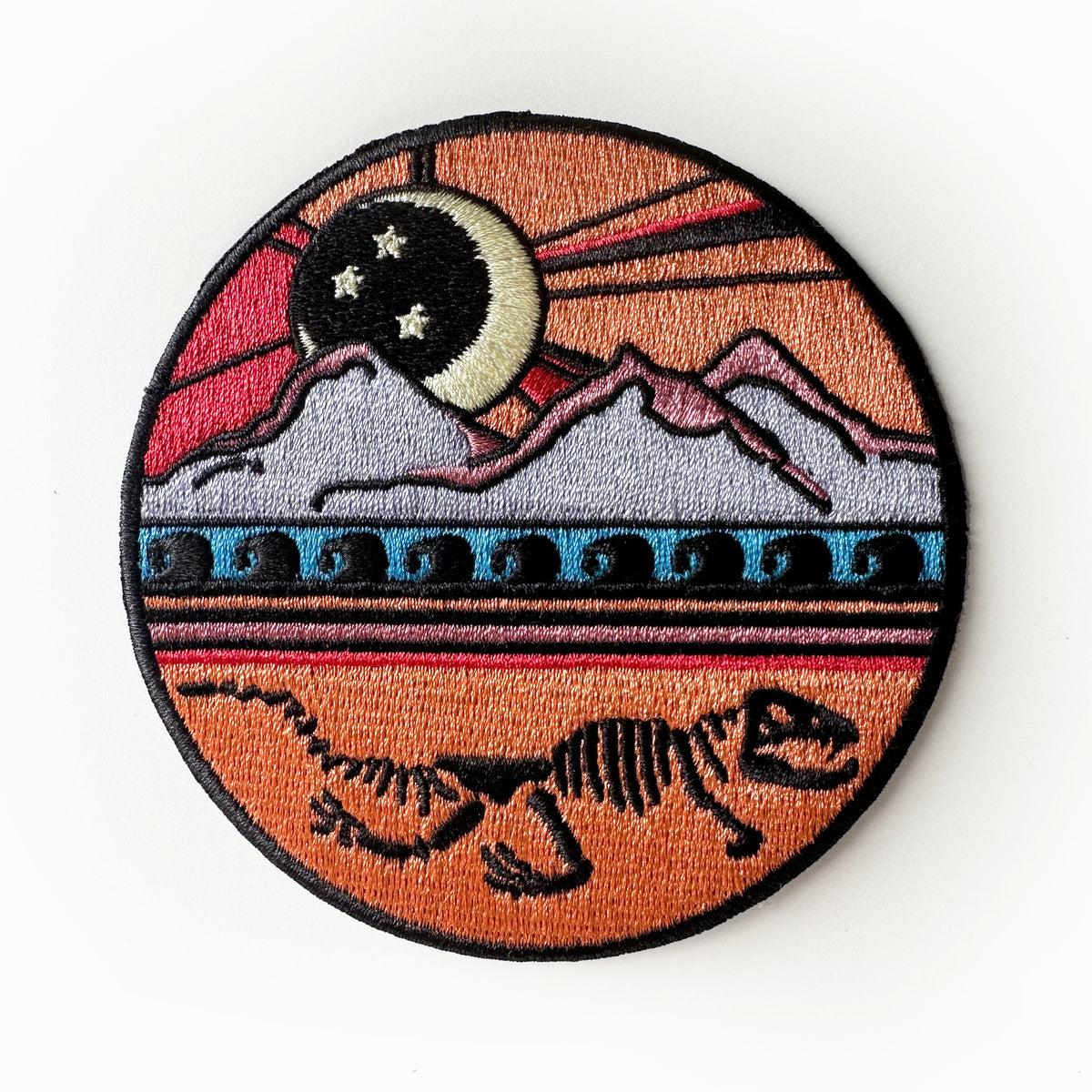 Dinosaur Skeleton Mountain Iron On Patch